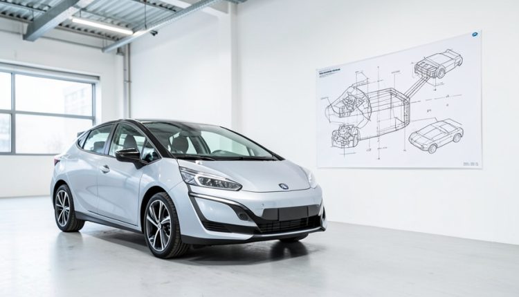 Finished modern car parked in a bright factory beside a large technical blueprint sketch on the wall